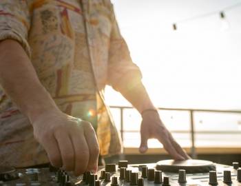 DJ spinning on a rooftop
