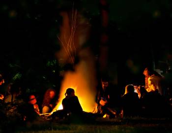 People around a bonfire at night