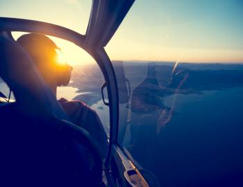 cockpit view of a helicopter as pilot flies