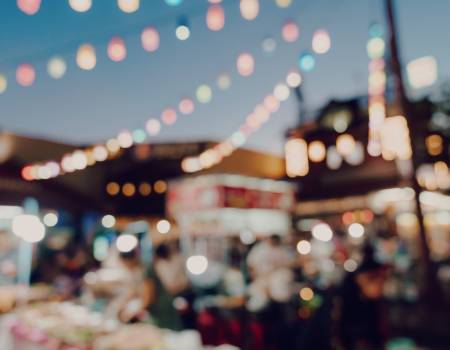 blurry string lights at a night market