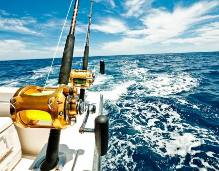 Fishing reels on the side of a boat