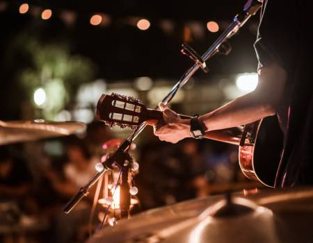 person playing guitar on stage