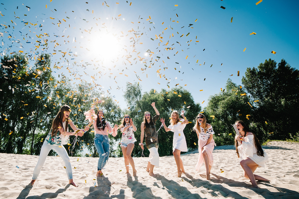 girls on bachelorette trip at the beach