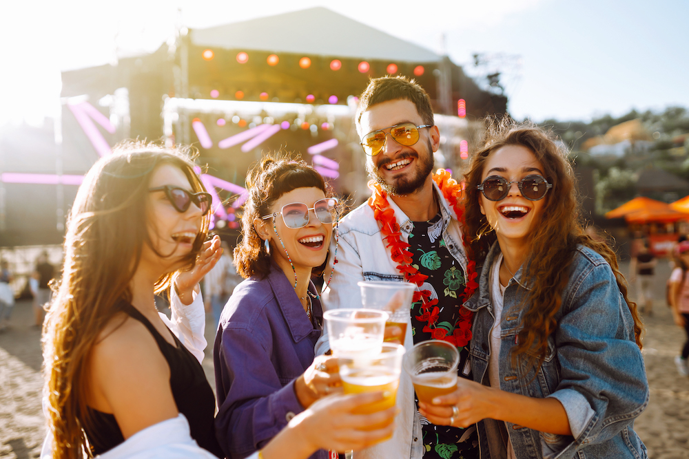 friends at music festival on the beach